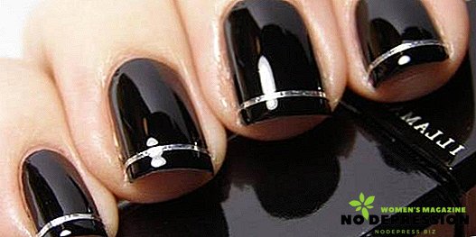 Black lacquer manicure as a sign of sophistication and mystery